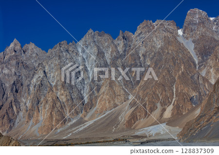 The autumn scenery with Tupopdan, Passu Cathedral or Passu Cones, is a mountain in northern Pakistan The autumn scenery with Tupopdan, Passu Cathedral or Passu Cones, is a mountain in northern Pakistan 128837309