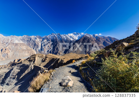 The autumn scenery with Tupopdan, Passu Cathedral or Passu Cones, is a mountain in northern Pakistan The autumn scenery with Tupopdan, Passu Cathedral or Passu Cones, is a mountain in northern Pakistan 128837335