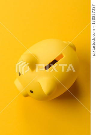 Piggy bank as a financial conceptual background with coins, doing business 128837357