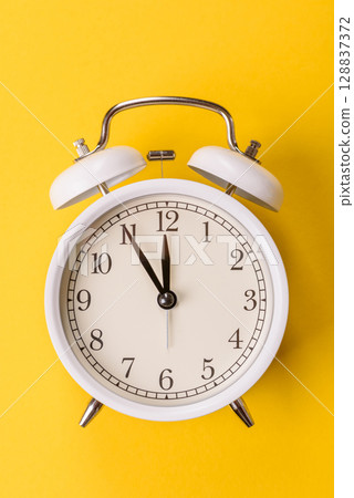 Vintage alarm clock as a conceptual background for deadlines for tasks in business Vintage alarm clock as a conceptual background for deadlines for tasks in business 128837372