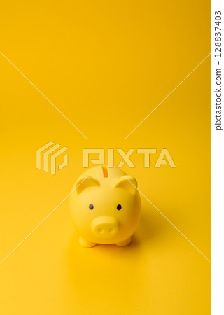 Piggy bank as a financial conceptual background with coins, doing business Piggy bank as a financial conceptual background with coins, doing business 128837403