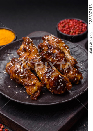 Grilled chicken wings in teriyaki sauce. Hot spicy takeaway food 128837418