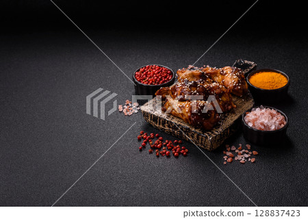 Grilled chicken wings in teriyaki sauce. Hot spicy takeaway food Grilled chicken wings in teriyaki sauce. Hot spicy takeaway food 128837423