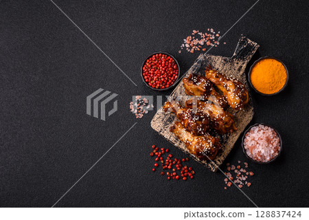 Grilled chicken wings in teriyaki sauce. Hot spicy takeaway food Grilled chicken wings in teriyaki sauce. Hot spicy takeaway food 128837424