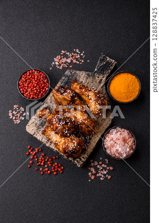 Grilled chicken wings in teriyaki sauce. Hot spicy takeaway food 128837425