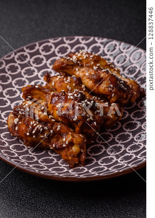 Grilled chicken wings in teriyaki sauce. Hot spicy takeaway food 128837446