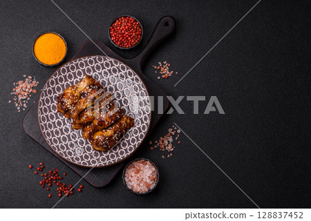 Grilled chicken wings in teriyaki sauce. Hot spicy takeaway food 128837452