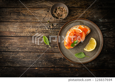 Sandwich with cream cheese and salmon 128837694