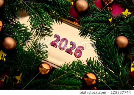 Golden New Year's background with the number of the coming year 2026. 128837744