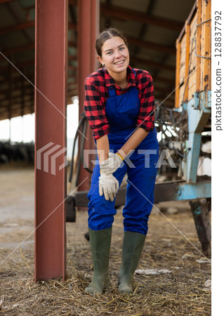 Young female worker posing on farm 128837792