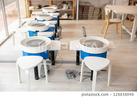 Automatic potter's wheels in equipped work room Automatic potter's wheels in equipped work room 128838048