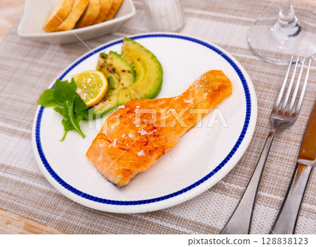 Salmon with avocado slices and lime Salmon with avocado slices and lime 128838123