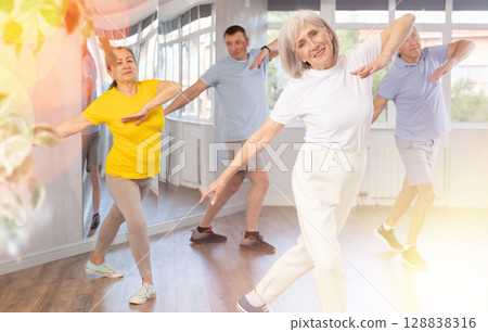 Elderly woman dances modern dances in group 128838316