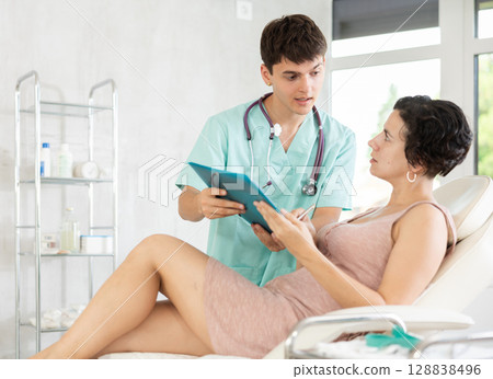 female patient documents signing 128838496