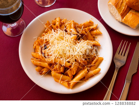 Penne pasta carbonara with minced meat and grated cheese Penne pasta carbonara with minced meat and grated cheese 128838882