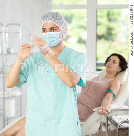 Intravenously injection female patient 128838971