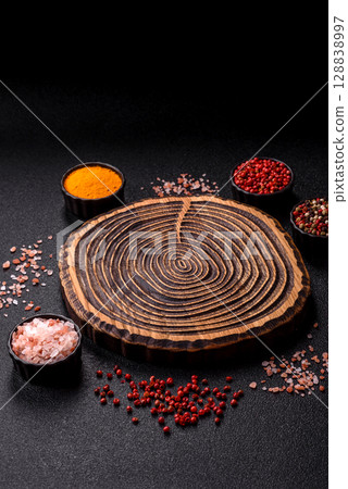 Wooden cutting board blank as a backdrop for cooking in the kitchen 128838997