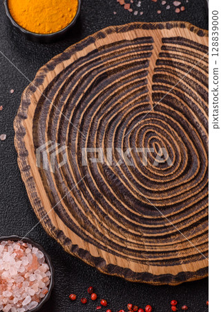 Wooden cutting board blank as a backdrop for cooking in the kitchen Wooden cutting board blank as a backdrop for cooking in the kitchen 128839000