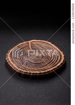 Wooden cutting board blank as a backdrop for cooking in the kitchen 128839008