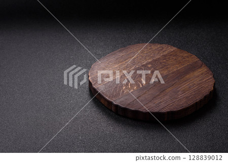 Wooden cutting board blank as a backdrop for cooking in the kitchen Wooden cutting board blank as a backdrop for cooking in the kitchen 128839012
