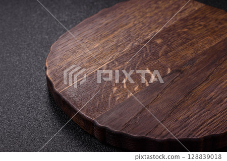 Wooden cutting board blank as a backdrop for cooking in the kitchen Wooden cutting board blank as a backdrop for cooking in the kitchen 128839018