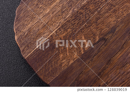 Wooden cutting board blank as a backdrop for cooking in the kitchen Wooden cutting board blank as a backdrop for cooking in the kitchen 128839019