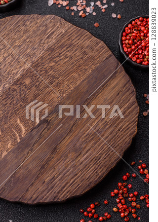 Wooden cutting board blank as a backdrop for cooking in the kitchen Wooden cutting board blank as a backdrop for cooking in the kitchen 128839023