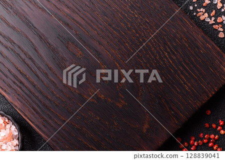 Wooden cutting board blank as a backdrop for cooking in the kitchen Wooden cutting board blank as a backdrop for cooking in the kitchen 128839041