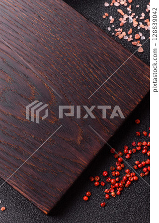 Wooden cutting board blank as a backdrop for cooking in the kitchen Wooden cutting board blank as a backdrop for cooking in the kitchen 128839042