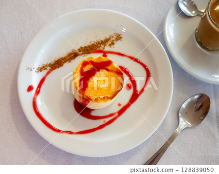 Tender creamy mousse cheesecake with currant sauce Tender creamy mousse cheesecake with currant sauce 128839050