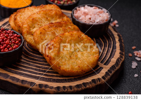 Potato hash browns, a meal with onions, cabbage in the form of fritters Potato hash browns, a meal with onions, cabbage in the form of fritters 128839138