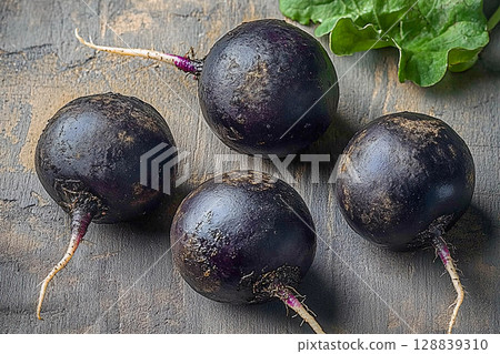 Fresh ripe organic black and white radishes isolated on white background Fresh ripe organic black and white radishes isolated on white background 128839310