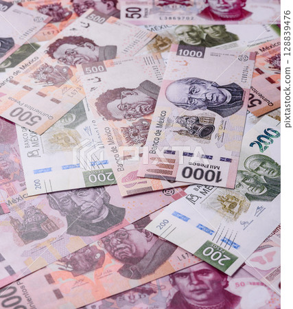 Money, Mexican currency, peso banknotes. Conceptual financial background 128839476