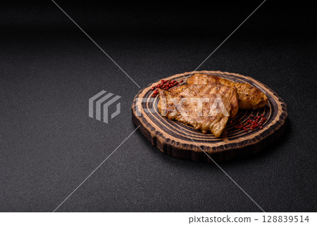 Chicken breast, grilled fillet, meat meal on a plate Chicken breast, grilled fillet, meat meal on a plate 128839514