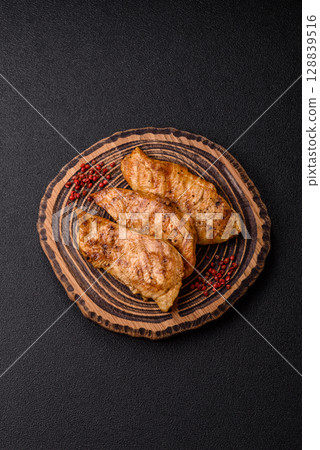 Chicken breast, grilled fillet, meat meal on a plate Chicken breast, grilled fillet, meat meal on a plate 128839516