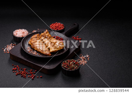 Chicken breast, grilled fillet, meat meal on a plate Chicken breast, grilled fillet, meat meal on a plate 128839544