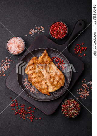 Chicken breast, grilled fillet, meat meal on a plate Chicken breast, grilled fillet, meat meal on a plate 128839546