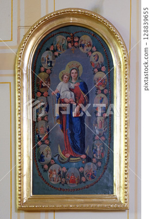 Virgin Mary Queen of the Holy Rosary altarpiece in parish church of the Holy Trinity in Krasic, Croatia 128839655