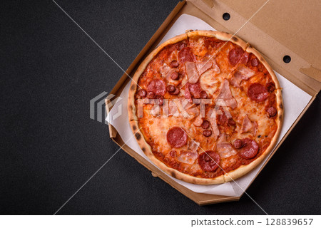 Italian pepperoni pizza with cheese and salami, tomatoes and sauce 128839657