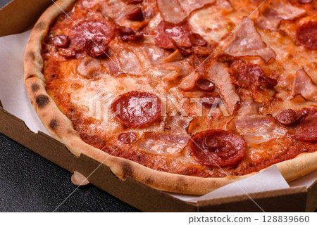Italian pepperoni pizza with cheese and salami, tomatoes and sauce 128839660