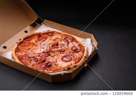 Italian pepperoni pizza with cheese and salami, tomatoes and sauce 128839668