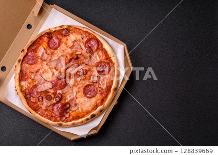 Italian pepperoni pizza with cheese and salami, tomatoes and sauce 128839669