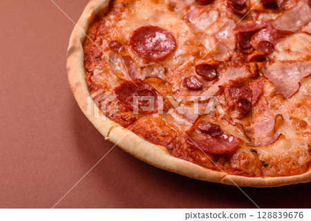 Italian pepperoni pizza with cheese and salami, tomatoes and sauce 128839676