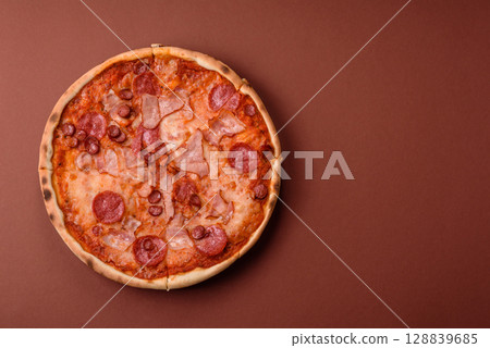 Italian pepperoni pizza with cheese and salami, tomatoes and sauce 128839685