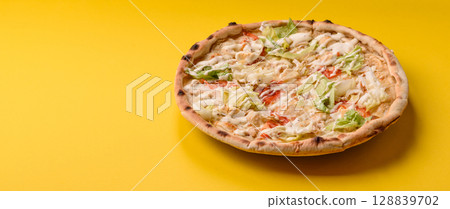 Italian caesar pizza with cheese and chicken, lettuce leaves and sauce Italian caesar pizza with cheese and chicken, lettuce leaves and sauce 128839702