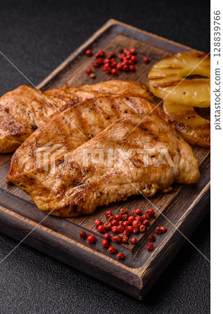 Chicken breast, grilled fillet, meat meal on a plate Chicken breast, grilled fillet, meat meal on a plate 128839766