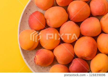 Fresh ripe fruit apricots are red yellow in color Fresh ripe fruit apricots are red yellow in color 128839896