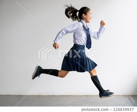 Young female junior high school student running in uniform 128839937
