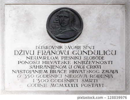 Memorial Plaque to Ivan Gundulic buried in the Franciscan church of the Friars Minor in Dubrovnik Memorial Plaque to Ivan Gundulic buried in the Franciscan church of the Friars Minor in Dubrovnik 128839976