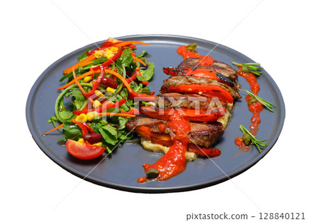 beef chop steak with salad , fried potatoes and sauce in dish. Food and Vegetable concept beef chop steak with salad , fried potatoes and sauce in dish. Food and Vegetable concept 128840121